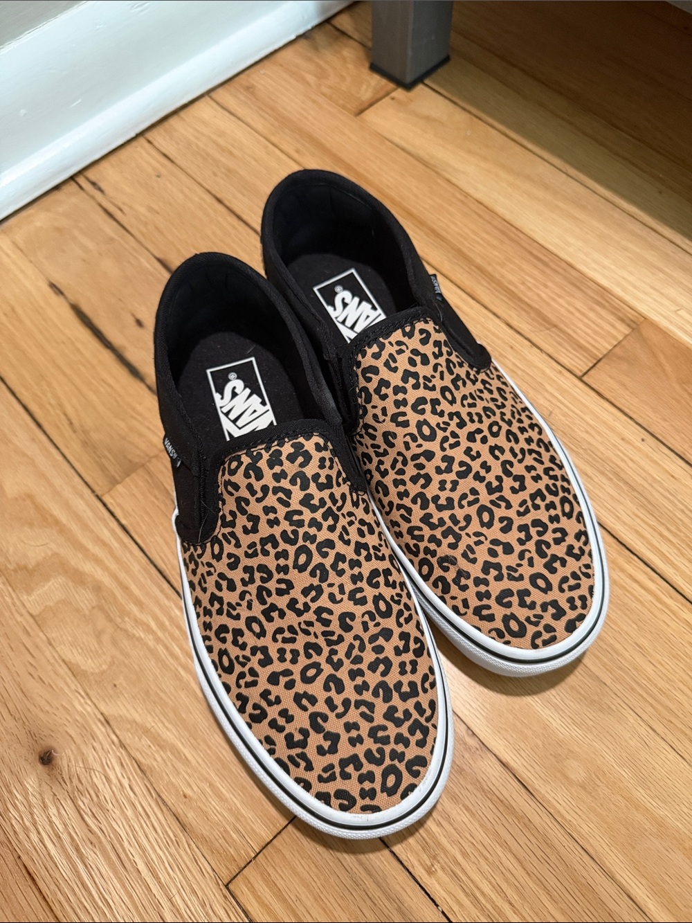 Vans Slip-On Sneakers in Leopard Tan and Black